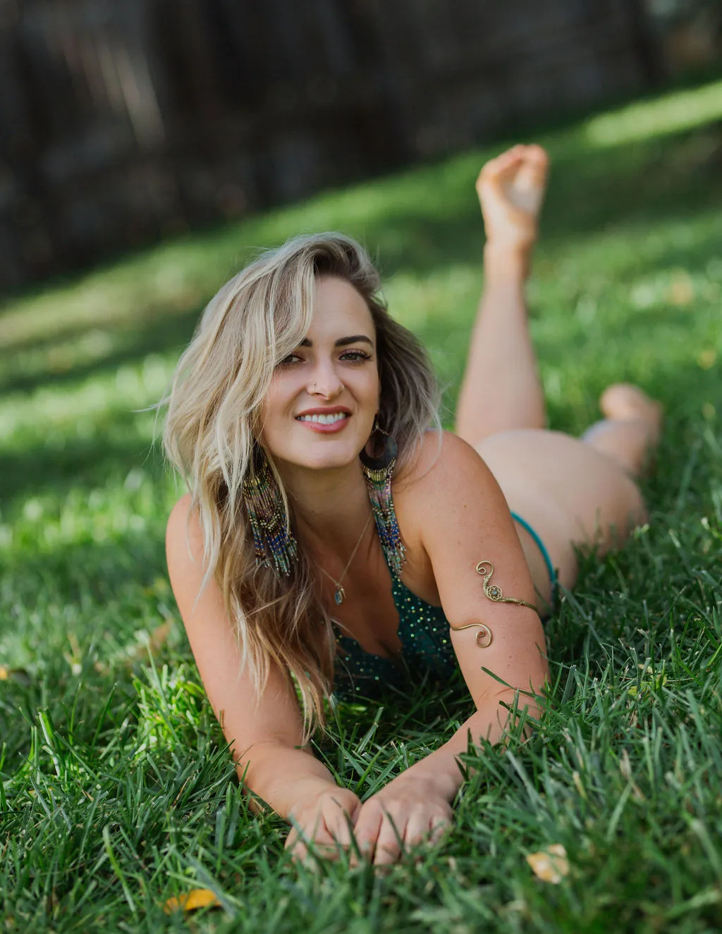 Taylor Tatum lying in the grass, smiling